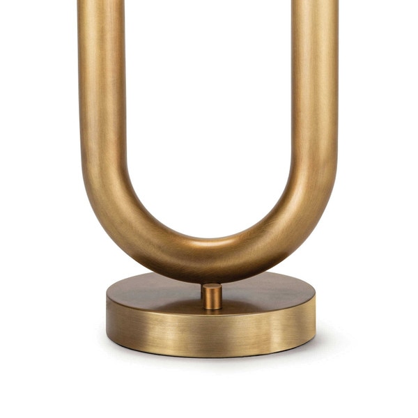 circular base of two arm natural brass table lamp